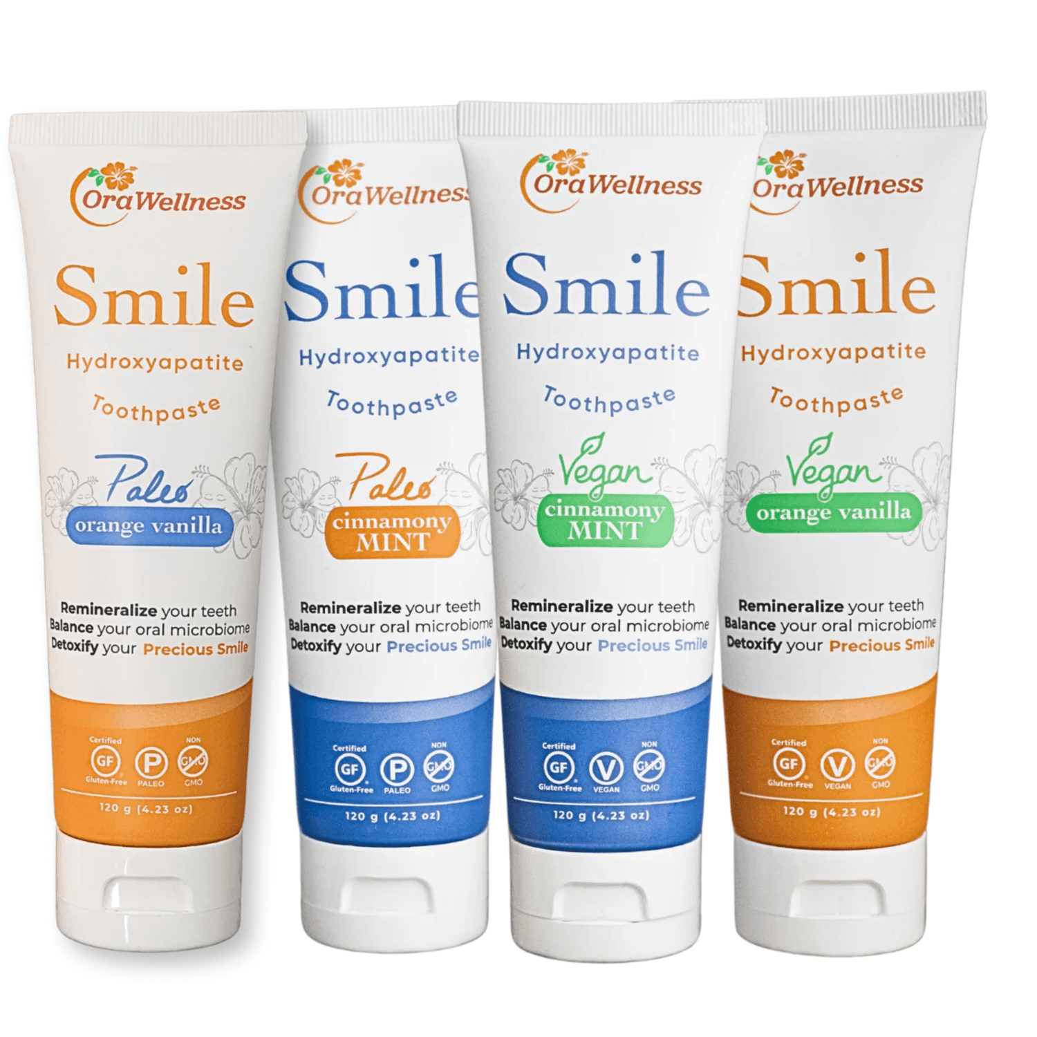 Four tubes of OraWellness Smile Toothpaste with different flavors and colors on a white background.